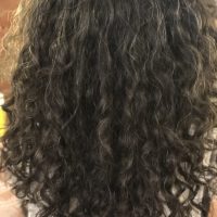 Long black curly hairstyle by Leslie Ellen Curly Hair Salon NYC