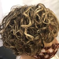 Short curly hair with blonde streaks styled by Leslie Ellen Curly Hair Salon NYC