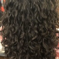 long black loose curly hairstyle by Leslie Ellen Curly Hair Salon NYC