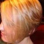 Woman with short blonde hair after makeover