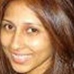 Woman with long tight black curls after makeover