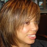 A close-up of a woman short straight hair after makeover