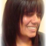 A woman with straight dark hair after makeover