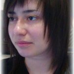 Woman with dark hair at a salon after makeover