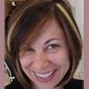 Woman with short dark hair and chunky blonde highlights